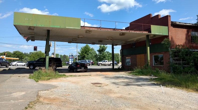 Landmark store and former gas station in the Hickory Flat community of Cherokee County has been torn down for a fast-food restaurant. (Brian O'Shea /bposhea@ajc.com)