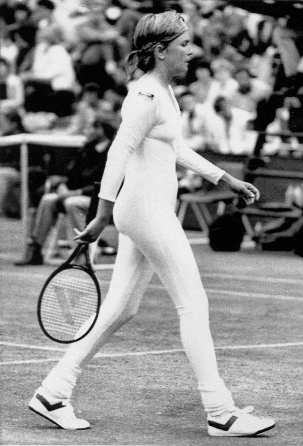 FILE - Tennis player Anne White of the U.S. is shown in a tight fitting body suit, which she has been banned from wearing in her resumed match against fellow American Pam Shriver, June 28, 1985. (AP Photo/Seelan Naidoo,File)