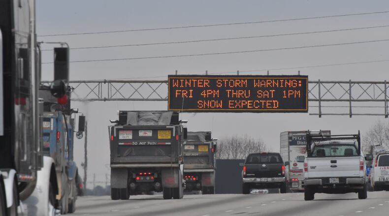 Metro Atlanta remains under a winter storm warning as some areas, including Cobb County, could see up to 4 inches of  snow accumulation. HYOSUB SHIN / HSHIN@AJC.COM