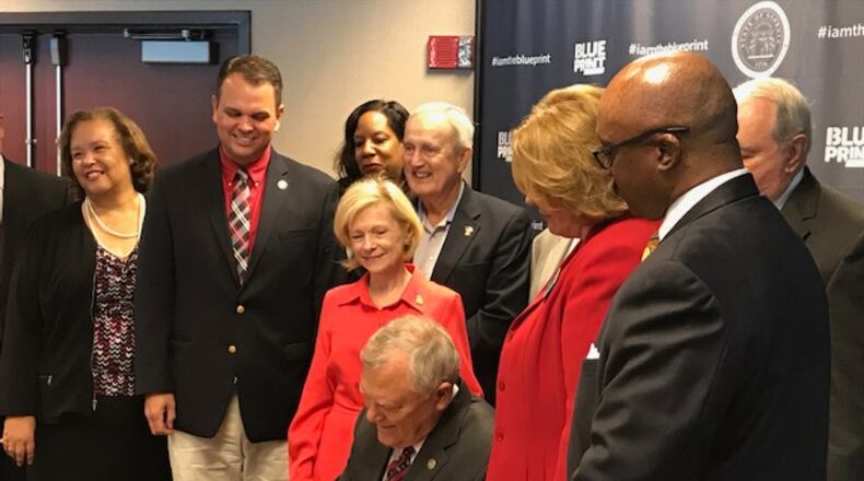 Gov. Nathan Deal, signing the fiscal 2018 budget, is telling most agencies not to expect any extra money next year.