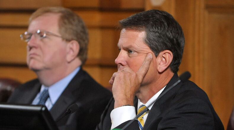 Georgia Secretary of State Brian Kemp (right). KENT D. JOHNSON/KDJOHNSON@AJC.COM