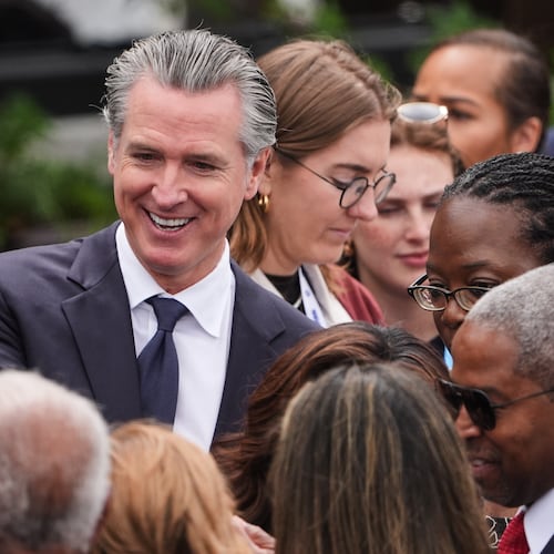 California Gov. Gavin Newsom mingles ahead of the Obama Presidential Center dedication ceremony Thursday, June 18, 2026, in Chicago. (AP Photo/Jeff Roberson)