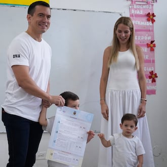 Ecuadorian President Daniel Noboa, accompanied by his family, votes in a referendum on whether to allow foreign military bases in the country and rewrite the constitution through a constituent assembly, in Olon, Ecuador, Sunday, Nov. 16, 2025. (AP Photo/Cesar Munoz)