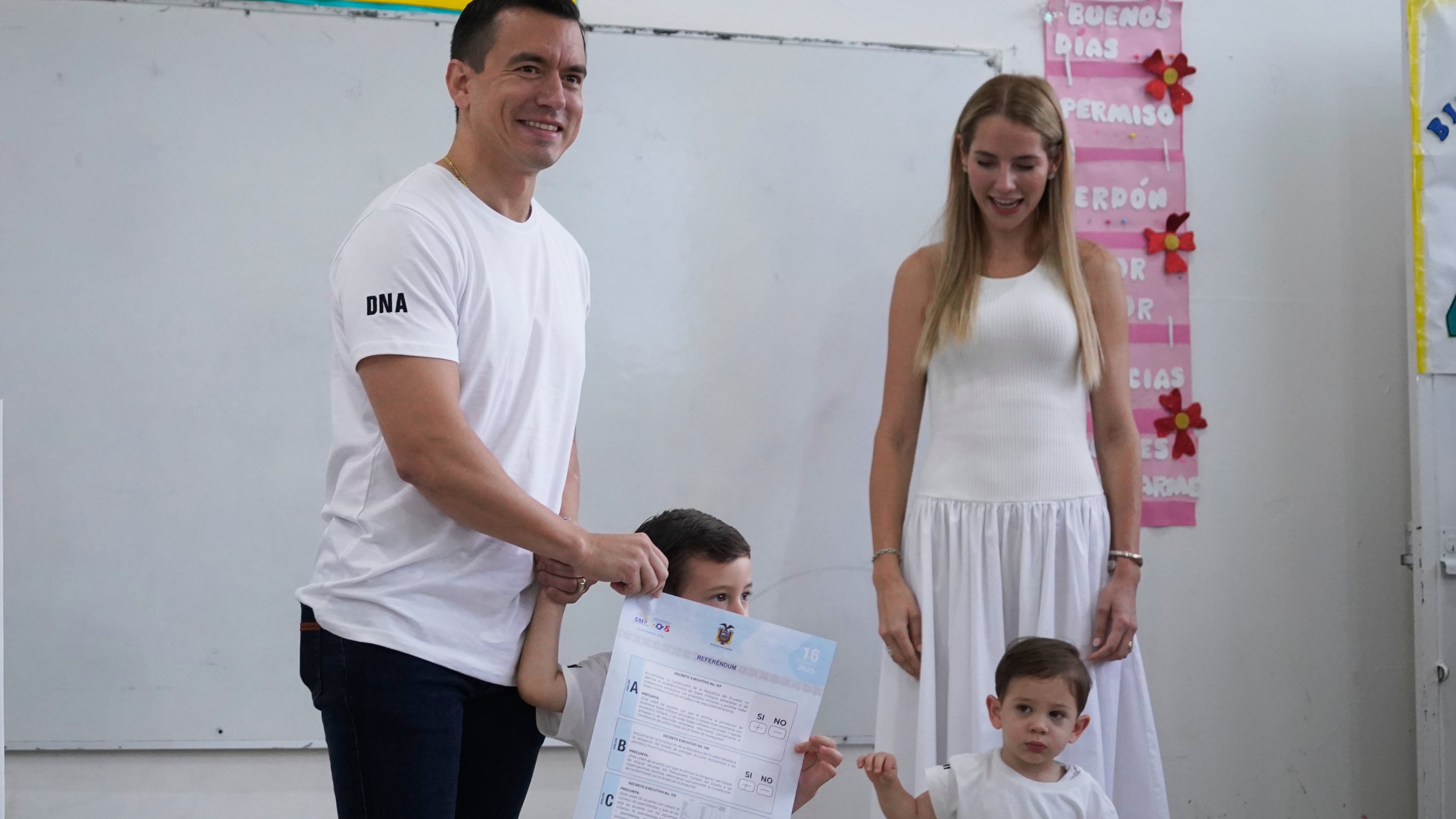 Ecuadorian President Daniel Noboa, accompanied by his family, votes in a referendum on whether to allow foreign military bases in the country and rewrite the constitution through a constituent assembly, in Olon, Ecuador, Sunday, Nov. 16, 2025. (AP Photo/Cesar Munoz)
