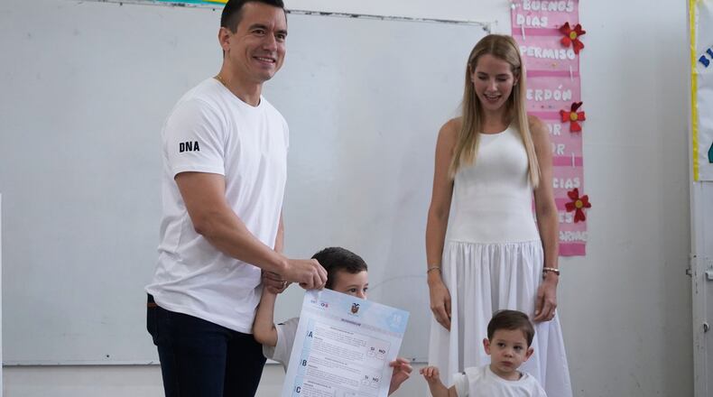 Ecuadorian President Daniel Noboa, accompanied by his family, votes in a referendum on whether to allow foreign military bases in the country and rewrite the constitution through a constituent assembly, in Olon, Ecuador, Sunday, Nov. 16, 2025. (AP Photo/Cesar Munoz)
