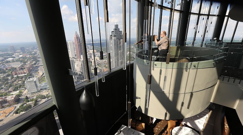 A visitor from South Dakota takes in the view of Atlanta from The Sun Dial Restaurant during an August visit to Atlanta. (CURTIS COMPTON /ccompton@ajc.com)