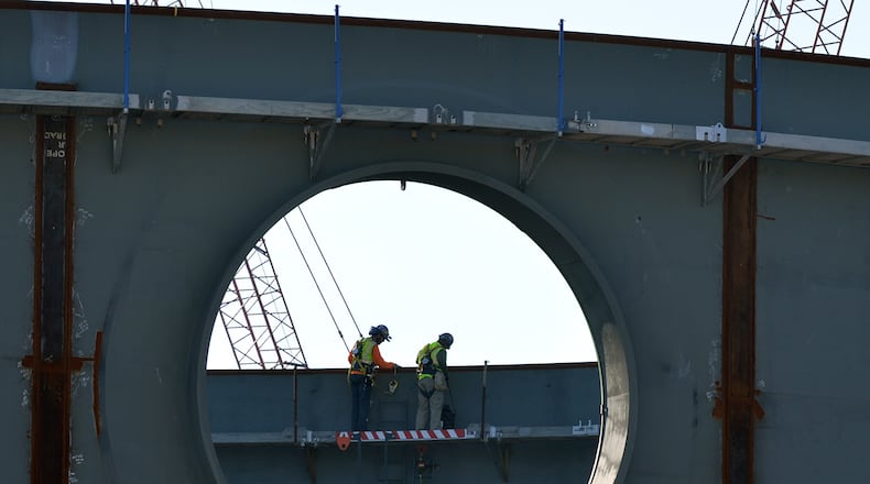 Workers inside the partly constructed containment structure on of one of the two new nuclear power plants being built at Plant Vogtle in February 2015. BRANT SANDERLIN / BSANDERLIN@AJC.COM