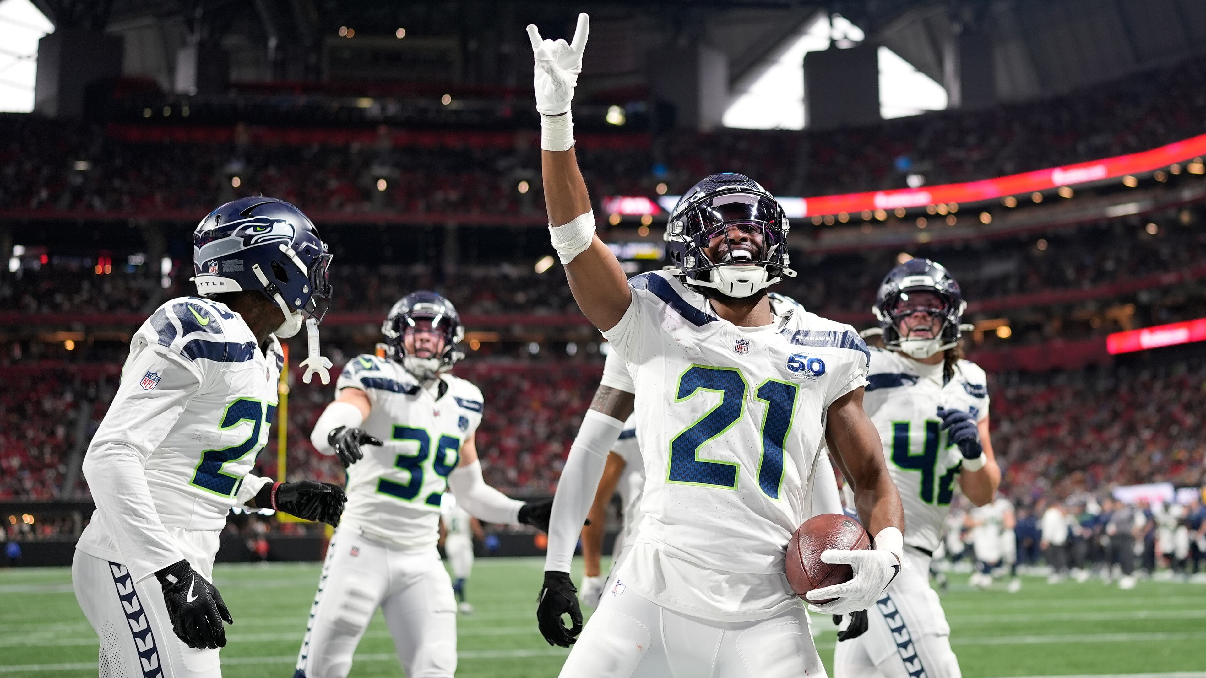 Seattle Seahawks cornerback Devon Witherspoon celebrates a fumble recovery against the Atlanta Falcons during the second half of an NFL football game, Sunday, Dec. 7, 2025, in Atlanta. (AP Photo/Mike Stewart)