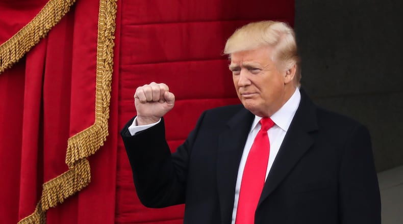 President Donald Trump pumps his fist. (AP Photo/Andrew Harnik)