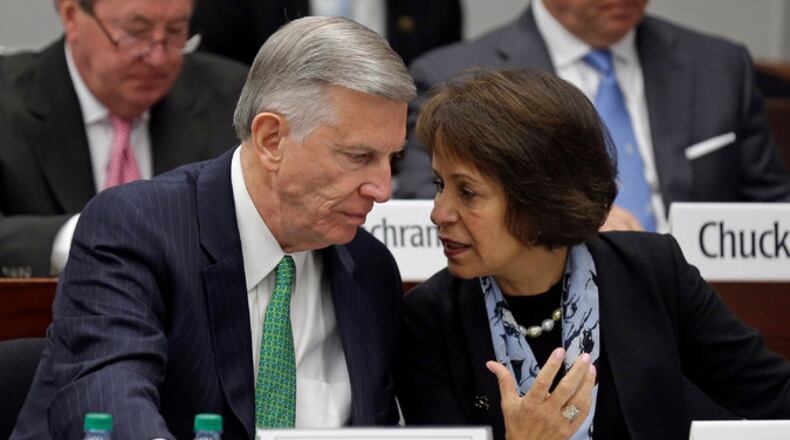 University of North Carolina president Tom Ross and chancellor Carol Folt. (Gerry Broome/Associated Press)