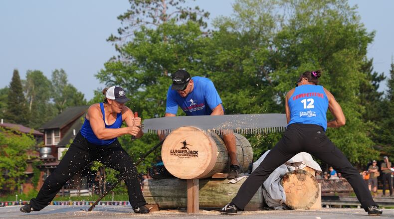 Kate Witkowski, left, and Erin Lavoie compete in the Jill and Jill event during the Lumberjack World Championships, Saturday, July 18, 2026, in Hayward, Wis. (AP Photo/Ellen Schmidt)