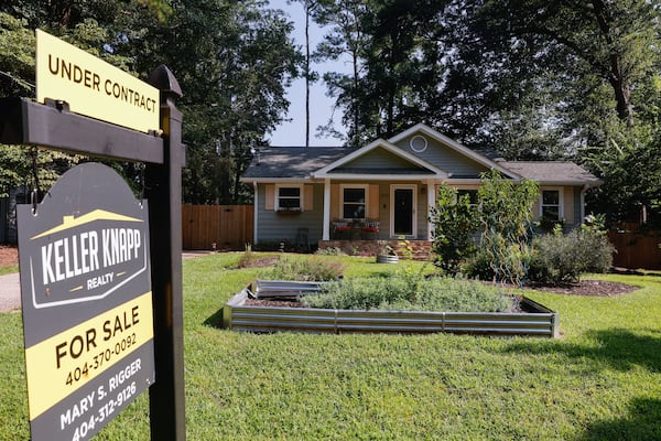 A Decatur home shows the "under contract" sign on Monday. (Natrice Miller/AJC)