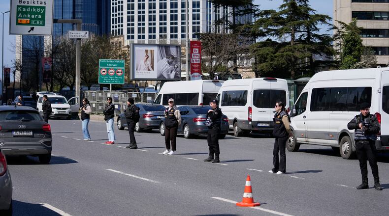 Turkish police secure the area after a gunmen attack at a building housing the Israeli Consulate in Istanbul, Turkey, Tuesday, April 7, 2026. (AP Photo/Khalil Hamra)