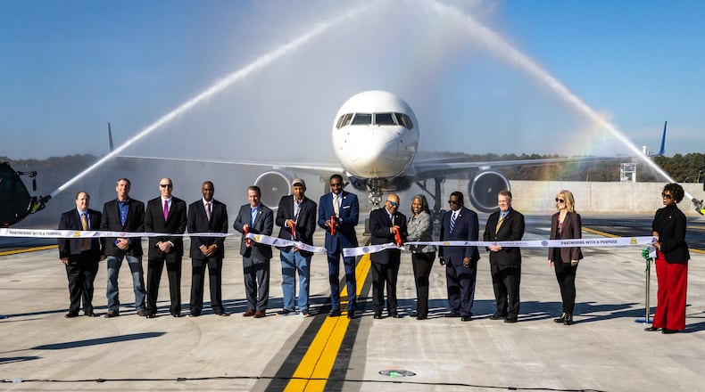 Atlanta Mayor Andre Dickens (Center) participates in a ribbon-cutting for a new Taxiway Improvement at Hartsfield-Jackson Atlanta International Airport Tuesday, Nov. 1, 2022. (Steve Schaefer/steve.schaefer@ajc.com)
