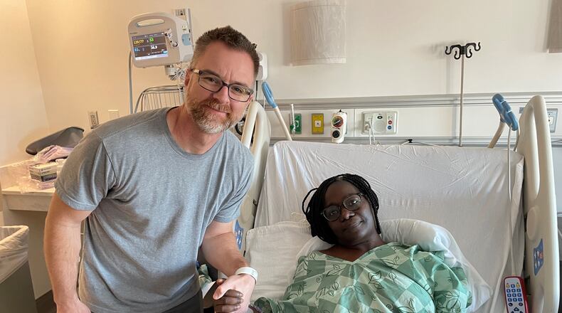 After Jimmie Deibert donated his kidney to co-worker Jeanine Ramirez, they shared a smile days after their surgeries. Courtesy of Kyra Ramirez