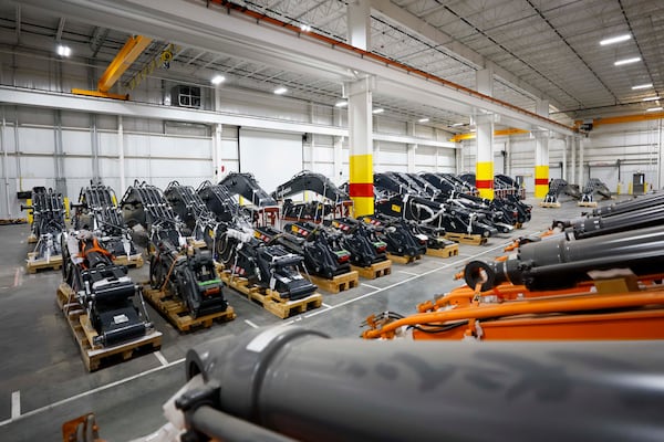 Heavy machinery components are prepared for assembly at a Georgia Port Authority facility in Brunswick, Ga., on Wednesday, Jan. 14, 2026. The GPA has developed import-export facilities at its Brunswick terminal for heavy equipment makers, including roll-in and roll-out services, as well as a covered space for final assembly. (Miguel Martinez/AJC)
