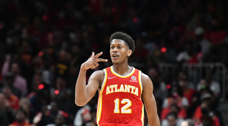 October 21, 2021 Atlanta - Atlanta Hawks forward De'Andre Hunter (12) reacts after scoring during the second half of the home opener in a NBA basketball game at State Farm Arena on Thursday, October 21, 2021. Atlanta Hawks won 113 - 87 over Dallas Mavericks. (Hyosub Shin / Hyosub.Shin@ajc.com)