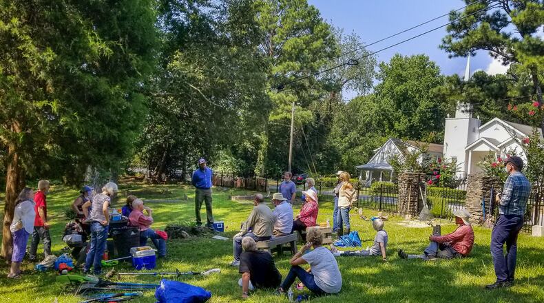 Pastor Richards III shares some history of New Hope's cemetery and the meaning of the cleanup event to the 35 volunteers.