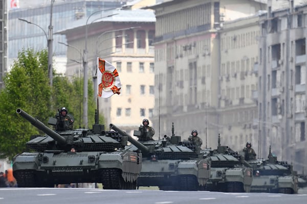 Russian battle tanks roll along the Garden Ring after the Victory Day military parade general rehearsal in Moscow, Russia, Wednesday, May 7, 2025. (AP Photo/Dmitry Serebryakov)
