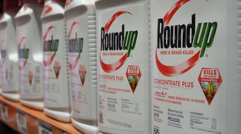 Monsanto has settled a $2 billion court case alleging its weedkiller, Roundup, caused a Georgia man's cancer. The verdict was the second largest in the state. (Robyn Beck/AFP/Getty Images/TNS)