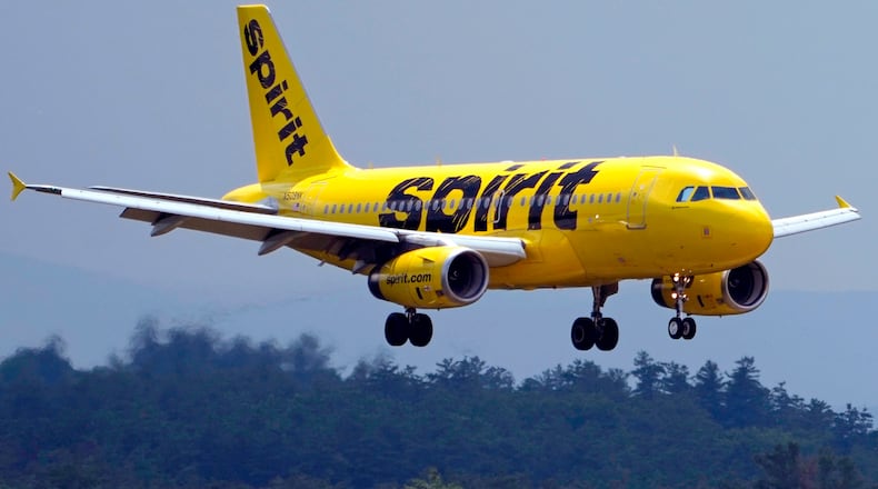 FILE - A Spirit Airlines 319 Airbus approaches Manchester Boston Regional Airport for a landing, June 2, 2023, in Manchester, N.H. (AP Photo/Charles Krupa, File)