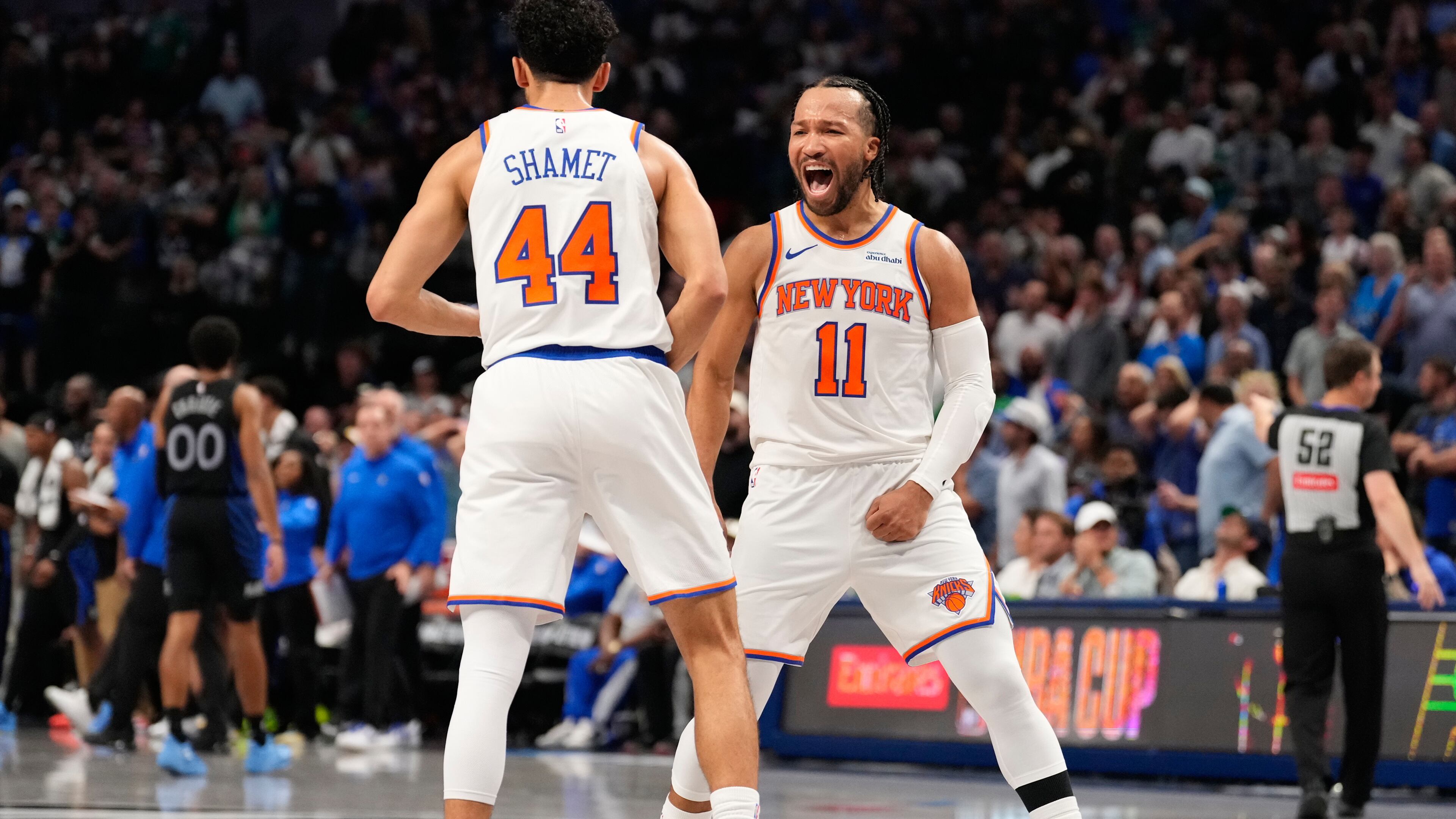 New York Knicks guard Jalen Brunson (11) celebrates with teammate Landry Shamet (44) in the second half of an NBA basketball game against the Dallas Mavericks Wednesday, Nov. 19, 2025, in Dallas. (AP Photo/Tony Gutierrez)