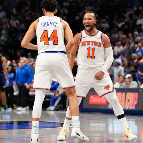 New York Knicks guard Jalen Brunson (11) celebrates with teammate Landry Shamet (44) in the second half of an NBA basketball game against the Dallas Mavericks Wednesday, Nov. 19, 2025, in Dallas. (AP Photo/Tony Gutierrez)