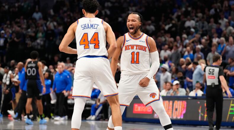 New York Knicks guard Jalen Brunson (11) celebrates with teammate Landry Shamet (44) in the second half of an NBA basketball game against the Dallas Mavericks Wednesday, Nov. 19, 2025, in Dallas. (AP Photo/Tony Gutierrez)