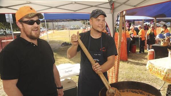 Stew masters stir their dish during the Brunswick Rockin’ Stewbilee, held annually at Brunswick’s Mary Ross Waterfront Park. (Courtesy of Brunswick Rockin’ Stewbilee)
