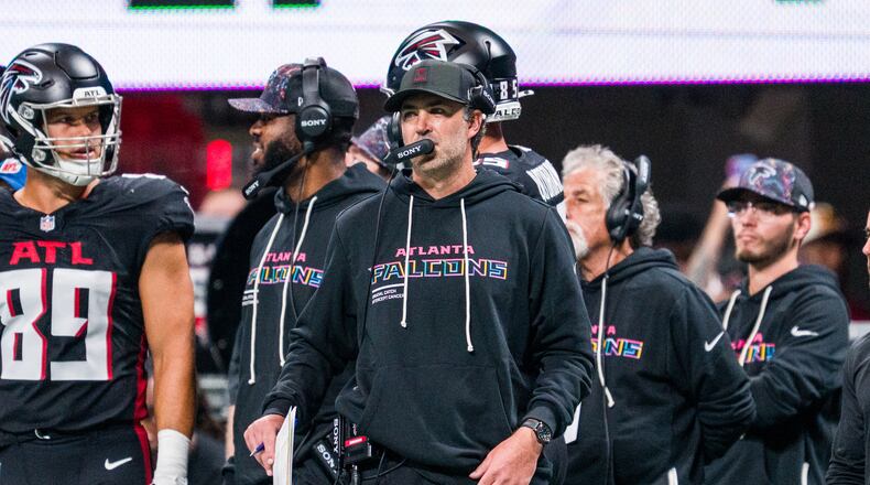 FILE - Atlanta Falcons offensive coordinator Zac Robinson works during the first half of an NFL football game against the Washington Commanders, Sunday, Sep. 28, 2025, in Atlanta. (AP Photo/Danny Karnik, File)