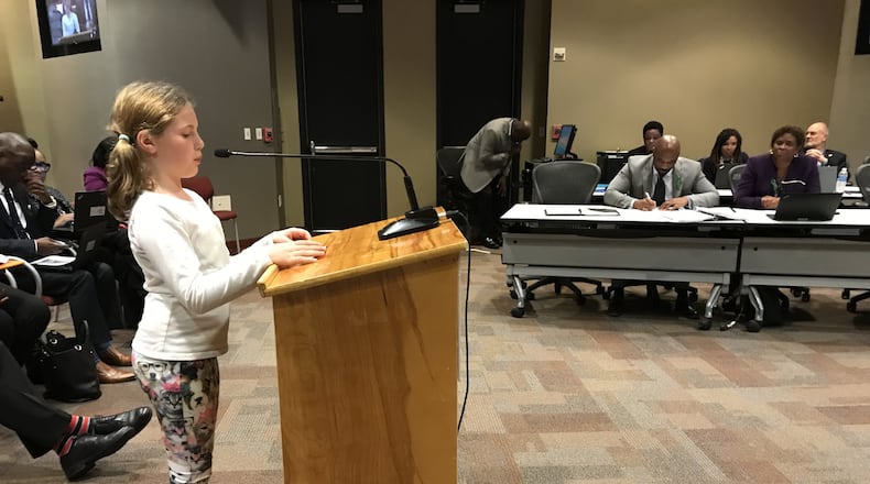 Falyn Handley, 10, a fifth-grader at Springdale Park Elementary School, wears dog-print leggings Monday while asking the Atlanta Board of Education to update the district’s student dress code policy. She collected more than 1,000 signatures on an online petition.