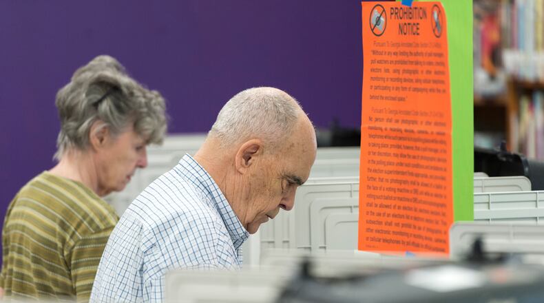 Dunwoody residents Fran Percarpio, center, and Ann Percarpio, left, cast their ballots at Chestnut Elementary School in Atlanta, Georgia, in the 6th Congressional District race on Tuesday, April 18, 2017. (DAVID BARNES / DAVID.BARNES@AJC.COM)