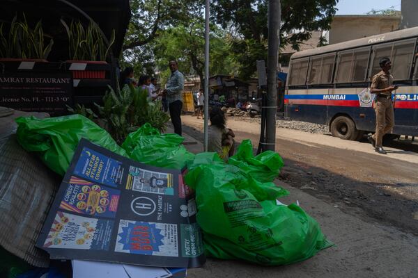 Posters and other paraphernalia are seen scattered outside the studio where Indian comedian Kunal Kamra allegedly made "defamatory" remarks against Shiv Sena politician Eknath Shinde, in Mumbai, India, Monday, March 24, 2025, after the venue was ransacked by Shiv Sena party workers. (AP Photo/Rafiq Maqbool)