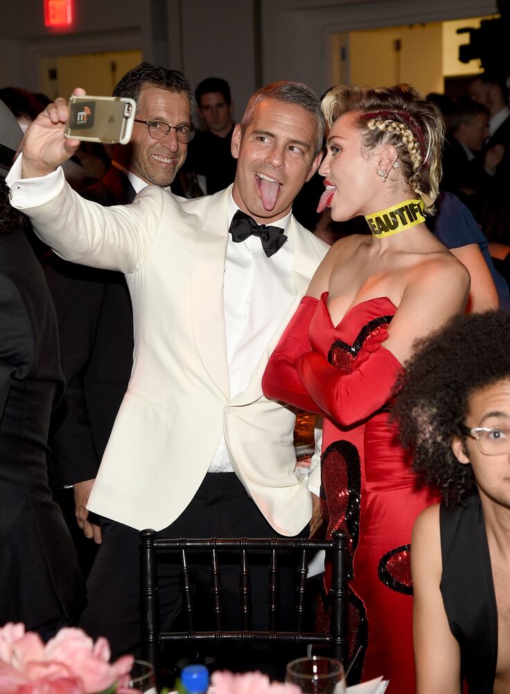 Andy Cohen and Miley Cyrus take a selfie during the amfAR Inspiration Gala
