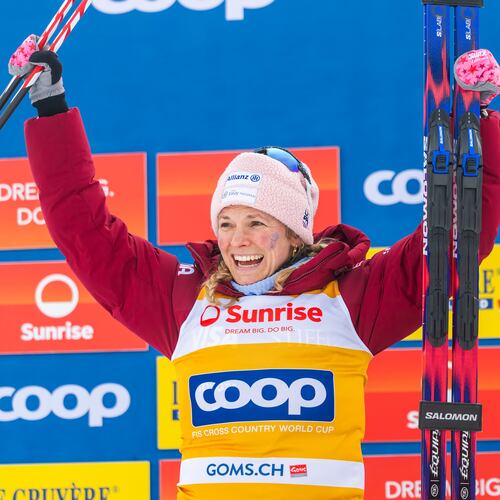 Second placed Jessie Diggins of United States celebrates on the podium after the women's 20km mass start classic skiing race, at the FIS Cross-Country World Cup at the Nordic Center Goms, in Geschinen, Switzerland, Sunday, Jan. 25, 2026. (Salvatore Di Nolfi/Keystone via AP)