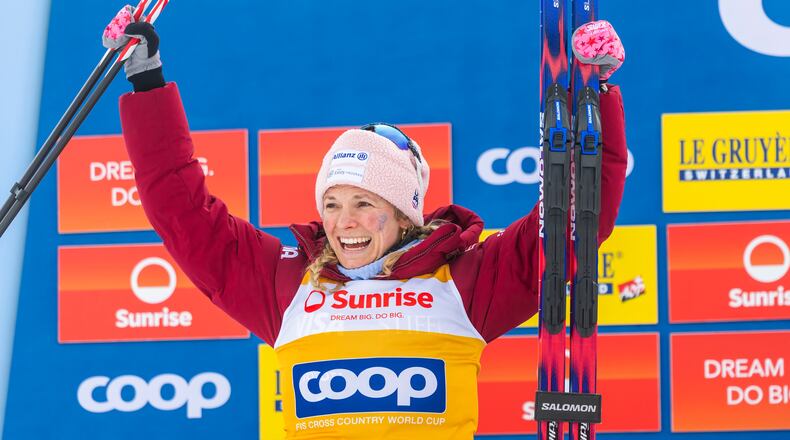 Second placed Jessie Diggins of United States celebrates on the podium after the women's 20km mass start classic skiing race, at the FIS Cross-Country World Cup at the Nordic Center Goms, in Geschinen, Switzerland, Sunday, Jan. 25, 2026. (Salvatore Di Nolfi/Keystone via AP)