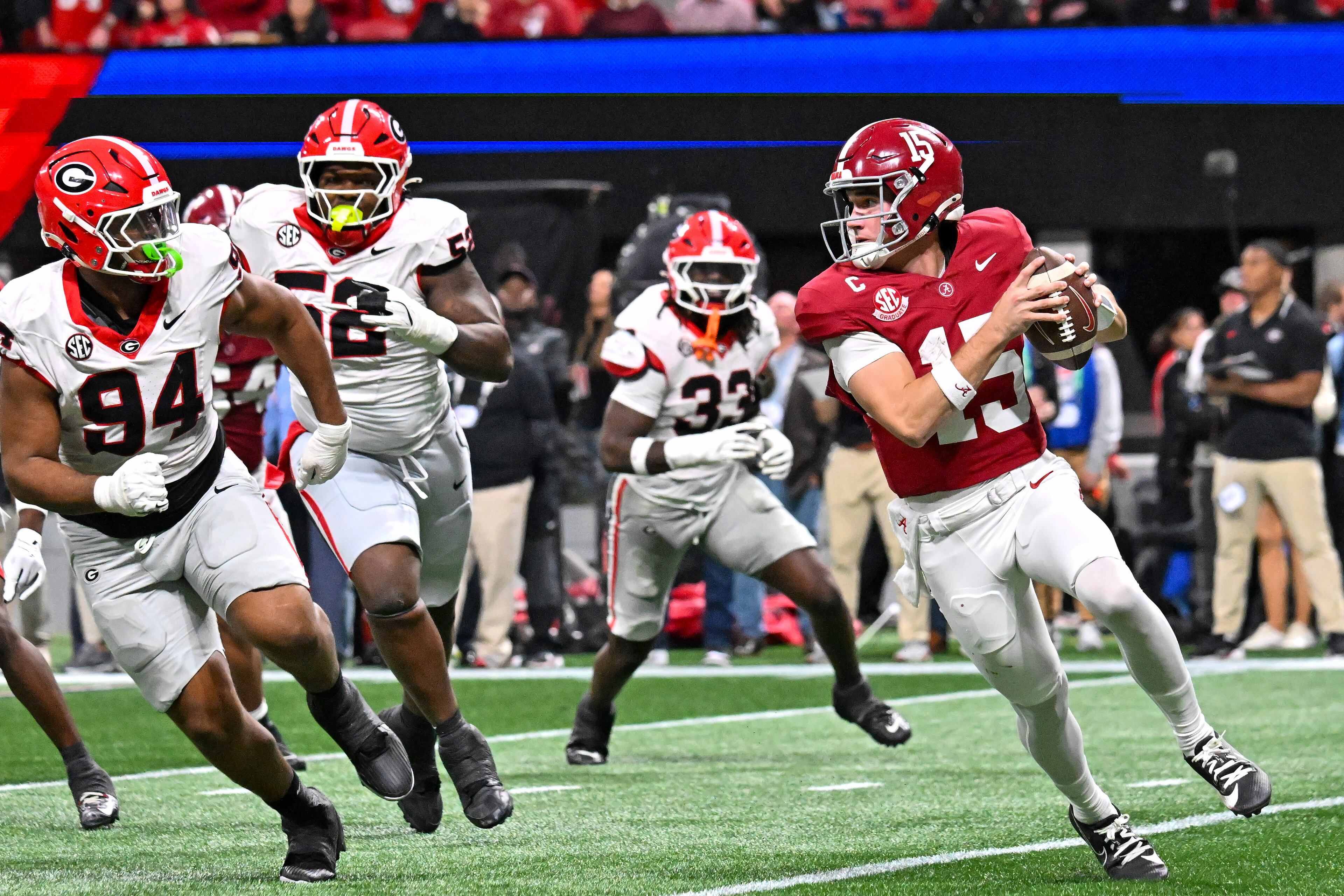 Alabama quarterback Ty Simpson (15) scrambles in the pocket under pressure from the Georgia defense during the third quarter of the SEC Championship game at Mercedes-Benz Stadium, Saturday, Dec. 6, 2025, in Atlanta. (Hyosub Shin / AJC)