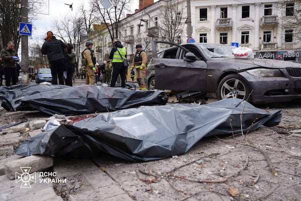In this photo provided by the Ukrainian Emergency Service, bodies of the killed residents lie on the ground following Russia's missile attack that killed at least 24 civilians in Sumy, Ukraine, Sunday, April 13, 2025. (Ukrainian Emergency Service via AP)