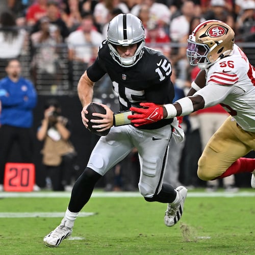 San Francisco 49ers defensive end Keion White (56) sacks Las Vegas Raiders quarterback Fernando Mendoza (15) during the first half of an NFL preseason football game, Thursday, Aug. 27, 2026}, in Las Vegas. (AP Photo/David Becker)
