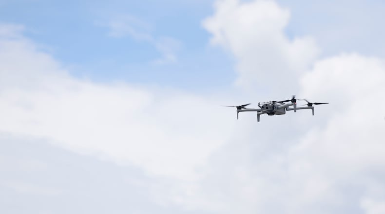 The FBI grounded more than a dozen recreational drones Thursday, the first day of the FIFA Fan Festival at Centennial Olympic Park in Atlanta. Here, FBI officials demonstrate a drone in May after announcing flight restrictions in Atlanta during the World Cup. (Akili-Casundria Ramsess for the AJC)