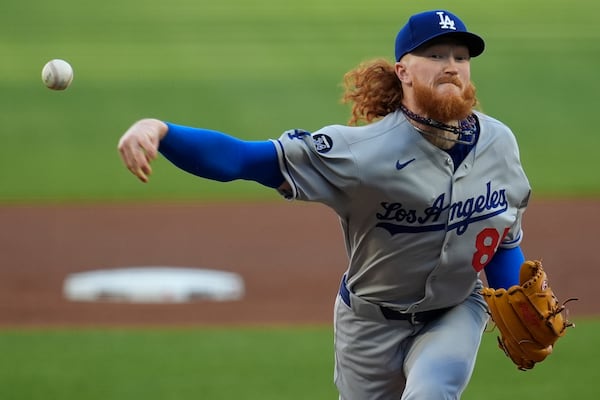Los Angeles Dodgers pitcher Dustin May (85) works against the Atlanta Braves in the first inning of a baseball game, Sunday, May 4, 2025, in Atlanta. (AP Photo/Mike Stewart)
