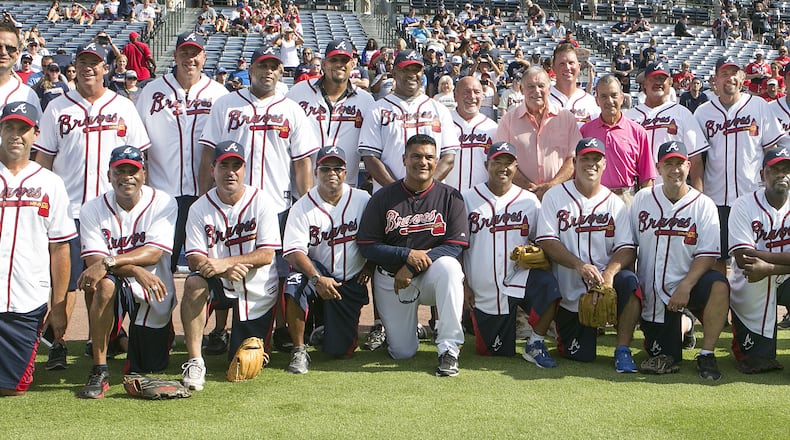 Members of the Atlanta Braves 1995 World Series team gather for a team portrait before a softball game against other Braves alumni at Turner Field in Atlanta on Saturday, August 8, 2015. (Photo by Phil Skinner)