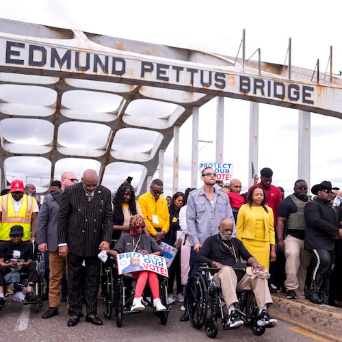 People march over the Edmund Pettus Bridge on the 61st Bloody Sunday Anniversary, Sunday, March 8, 2026, in Selma, Ala. (AP Photo/Mike Stewart)