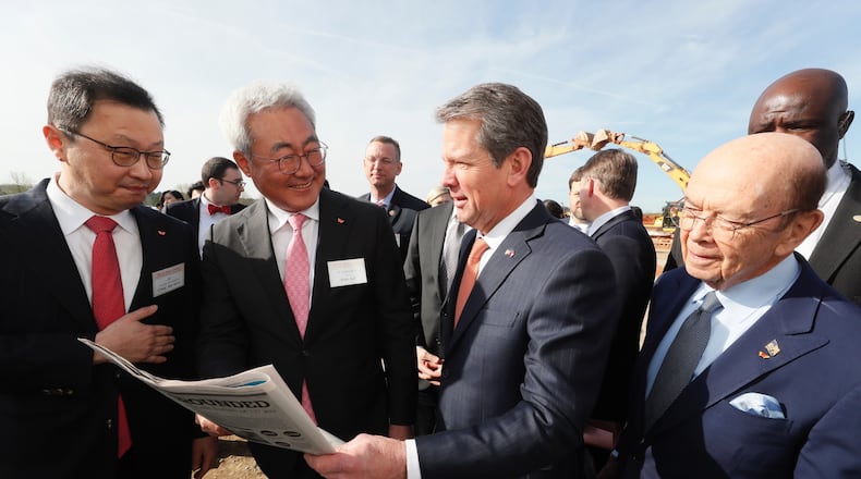 Gov. Brian Kemp meets with top officials of SK Innovation as they break ground on a new plant in Jackson County. Photo: Bob Andres/Atlanta Journal-Constitution