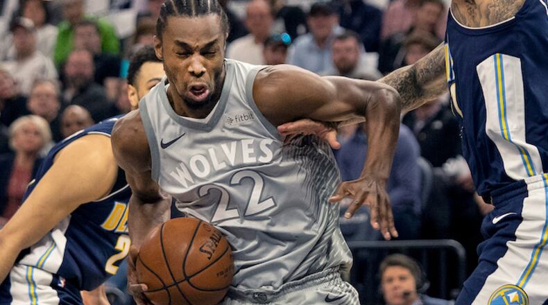 The Minnesota Timberwolves' Andrew Wiggins (22) drives to the basket in the first quarter against the Denver Nuggets on Wednesday, April 11, 2018, at the Target Center in Minneapolis. (Carlos Gonzalez/Minneapolis Star Tribune/TNS)