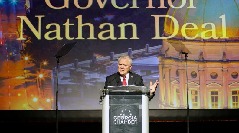 Gov. Nathan Deal addresses the Georgia Chamber’s Eggs & Issues breakfast on Wednesday. He’s called for a “clean” adoption bill. A Senate committee passed out one that contains language he vetoed last year. BOB ANDRES /BANDRES@AJC.COM