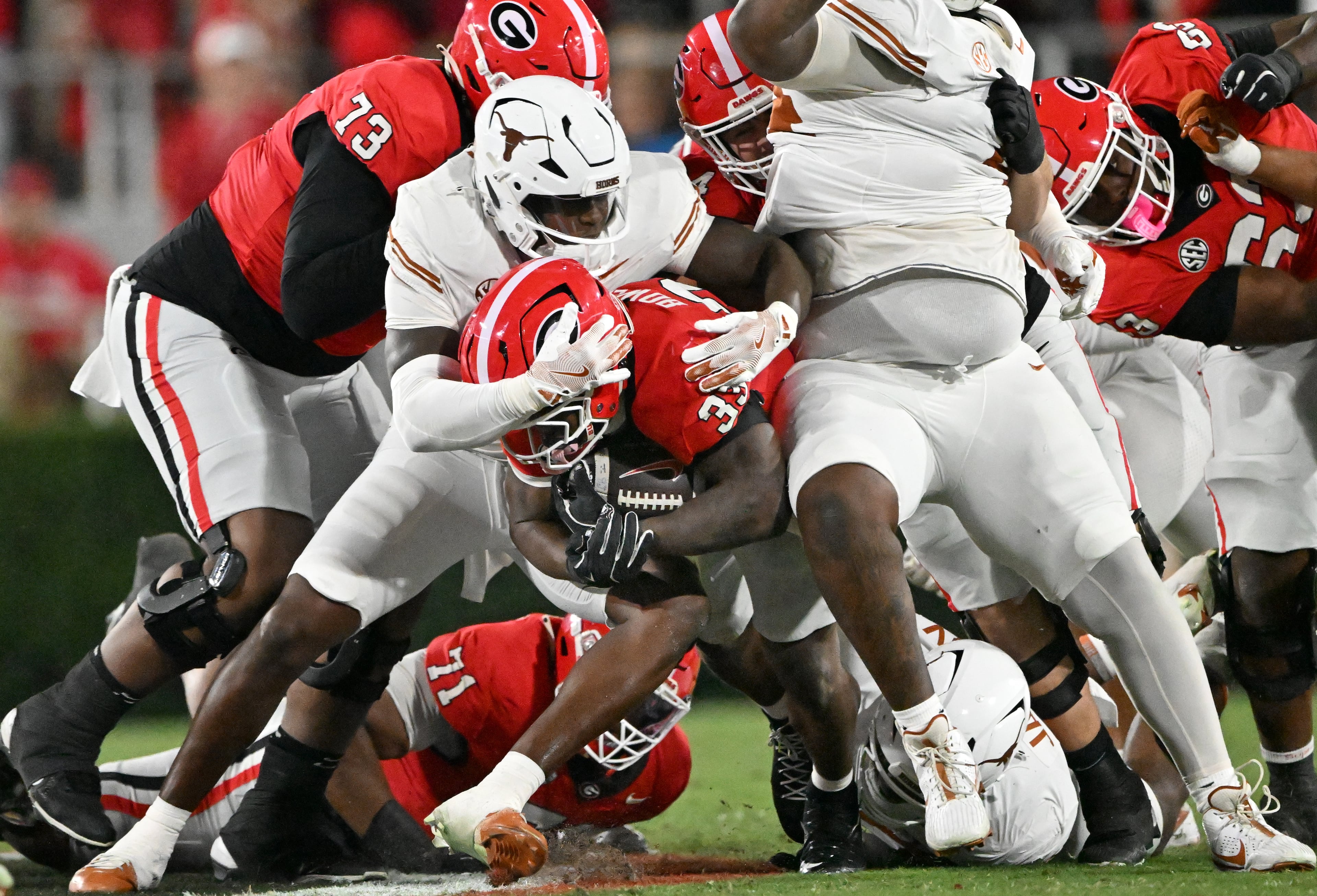 Georgia running back Chauncey Bowens (33) pushes for yardage during the first half in an NCAA football game at Sanford Stadium, Saturday, November 15, 2025, in Athens. Georgia won 35-10 over Texas. (Hyosub Shin / AJC)