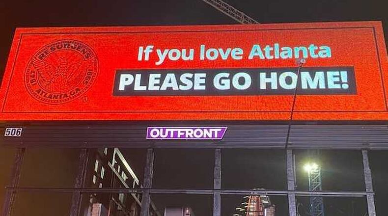 Atlanta officials posted this sign atop a billboard near Centennial Olympic Park on Friday, May 29, 2020 pleading with people to leave the area after some demonstrators looted several businesses and hurled objects at police. Most demonstrators were there to protest police misconduct, particularly the death of George Floyd, an African American man who died in police custody. ERIC STIRGUS/ESTIRGUS@AJC.COM.