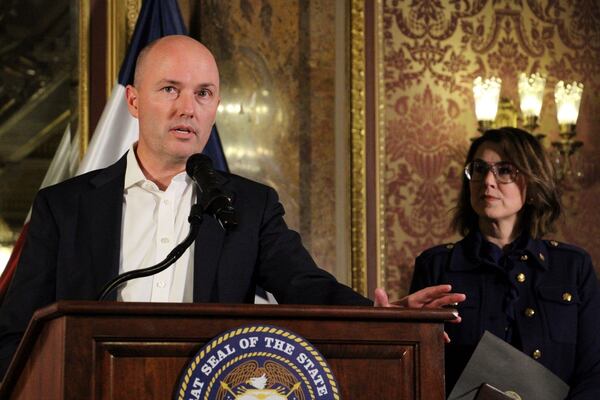 FILE - Utah Gov. Spencer Cox, left, and Lt. Gov. Deidre Henderson speak to reporters about a bill changing the state's mail-in voting system on the final day of the state's legislative session, Friday, March 7, 2025, in Salt Lake City. (AP Photo/Hannah Schoenbaum, File)