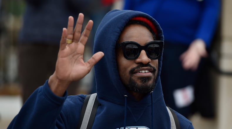 January 21, 2017, Atlanta - Entertainer Andre 3000, half of the rap duo Outkast, waves to the crowd during the Women's March in Atlanta, Georgia, on Saturday, January 21, 2017. (DAVID BARNES / DAVID.BARNES@AJC.COM)